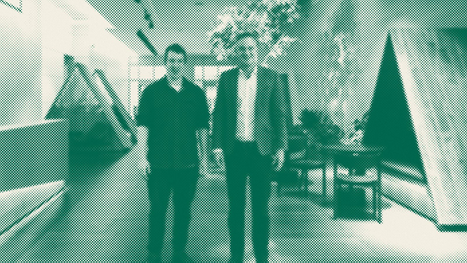 Halftone photo of two men standing in the lobby of Anthropic's office in San Francisco